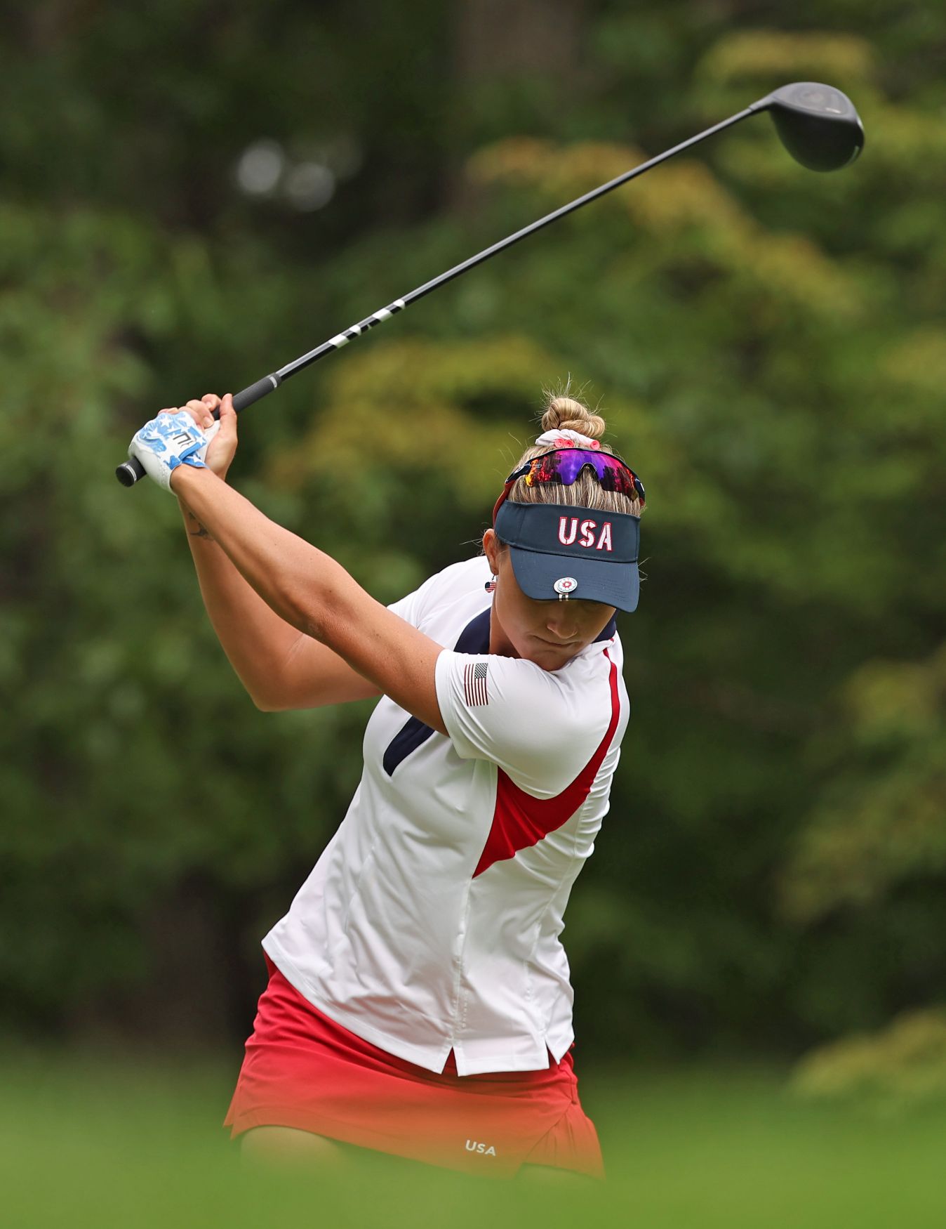 Lexie Thompson takes a swing at the ball.