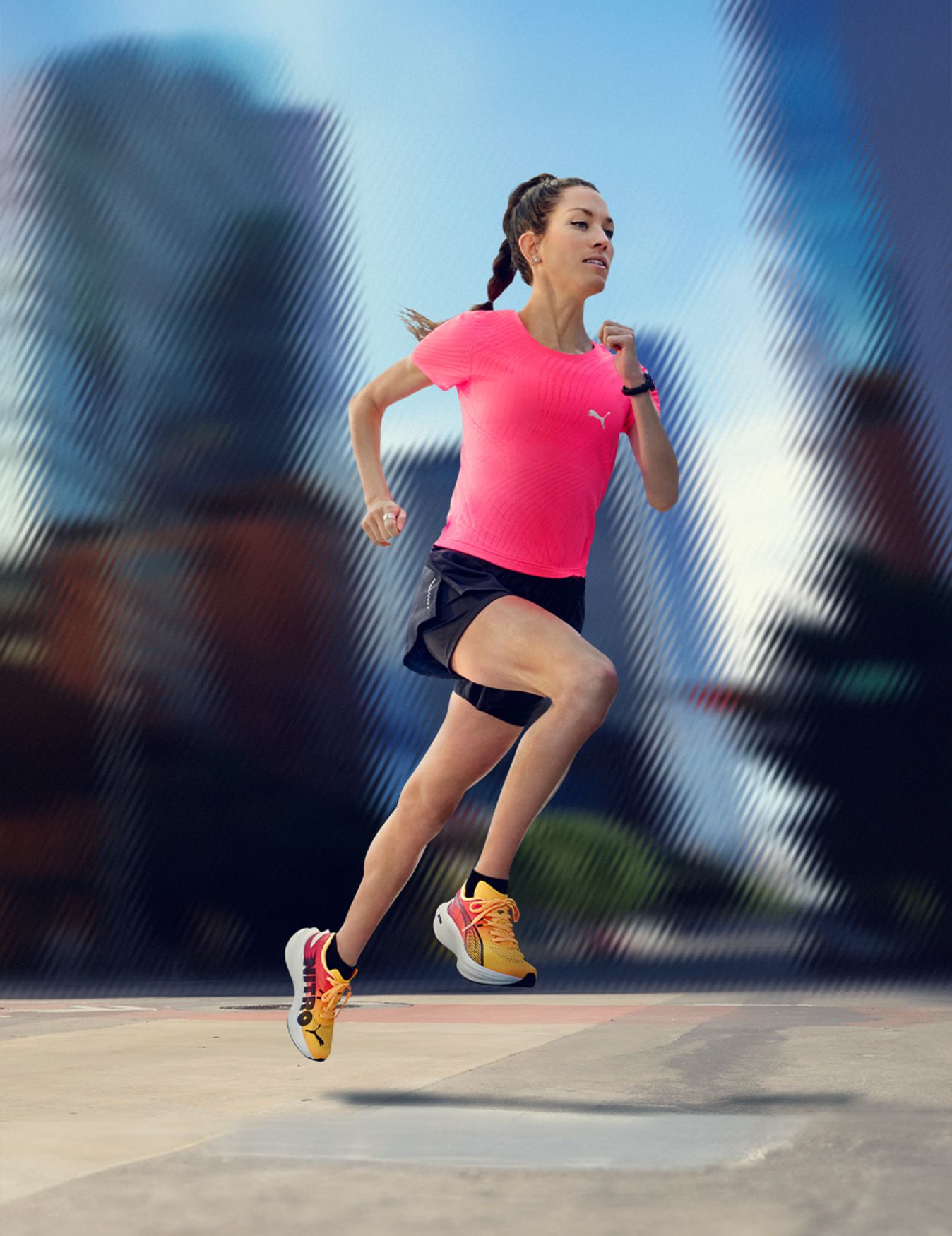 Fiona O'Keeffe runs in front of a skyline backdrop.