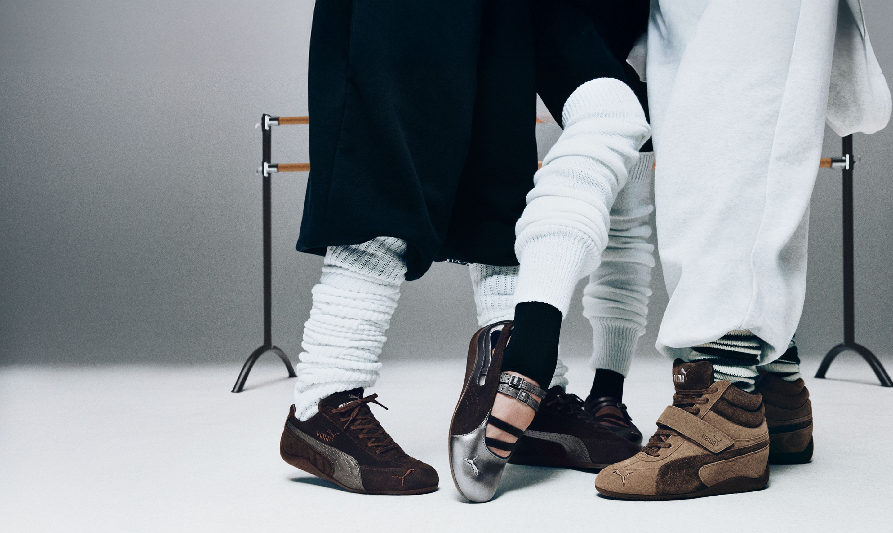 Dance studio with people in leg warmers wearing various Puma Speedcat models in brown and silver with a retro look